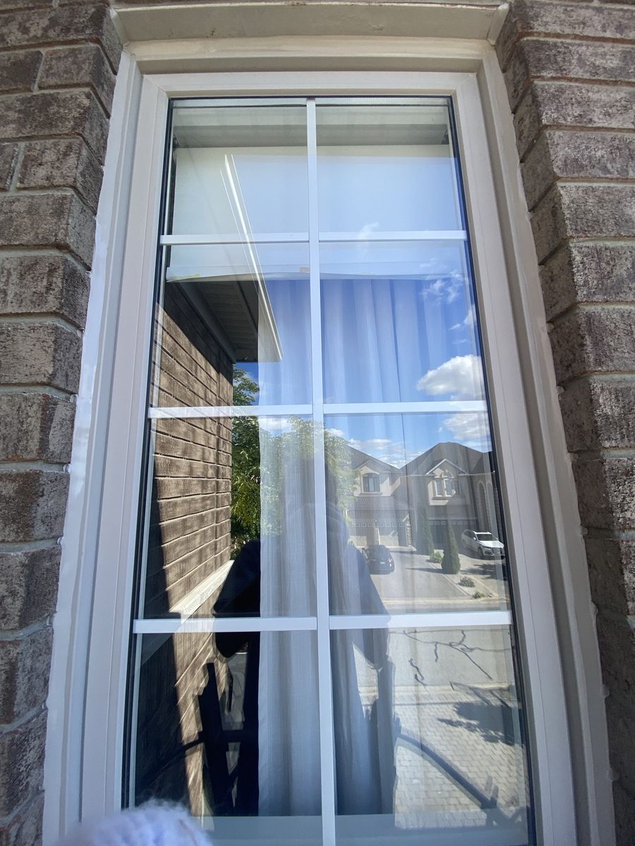 After: Brick window with grilles — old bead out, perimeter resealed