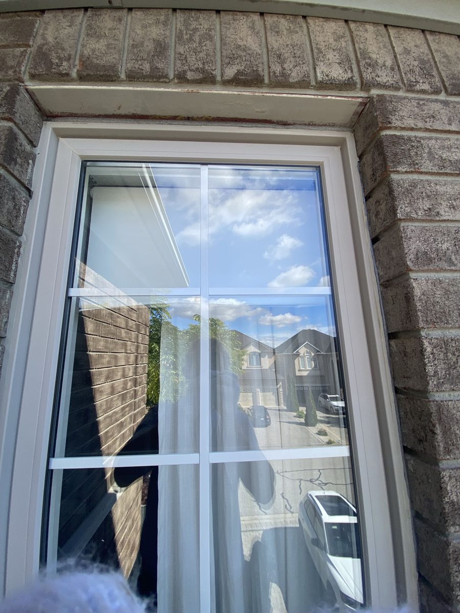 Before: Brick window with grilles — old bead out, perimeter resealed