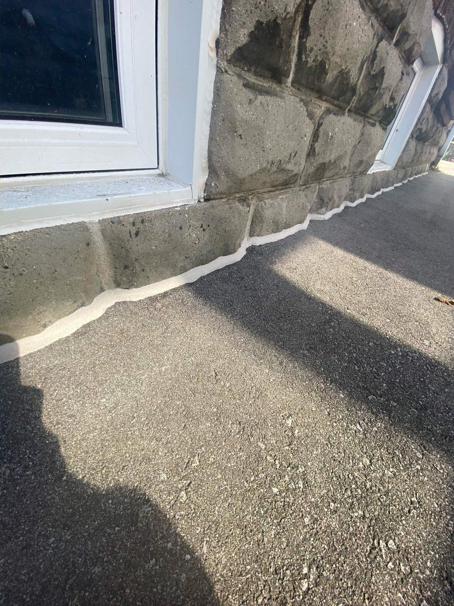 After: Stone window surround — perimeter joint reset