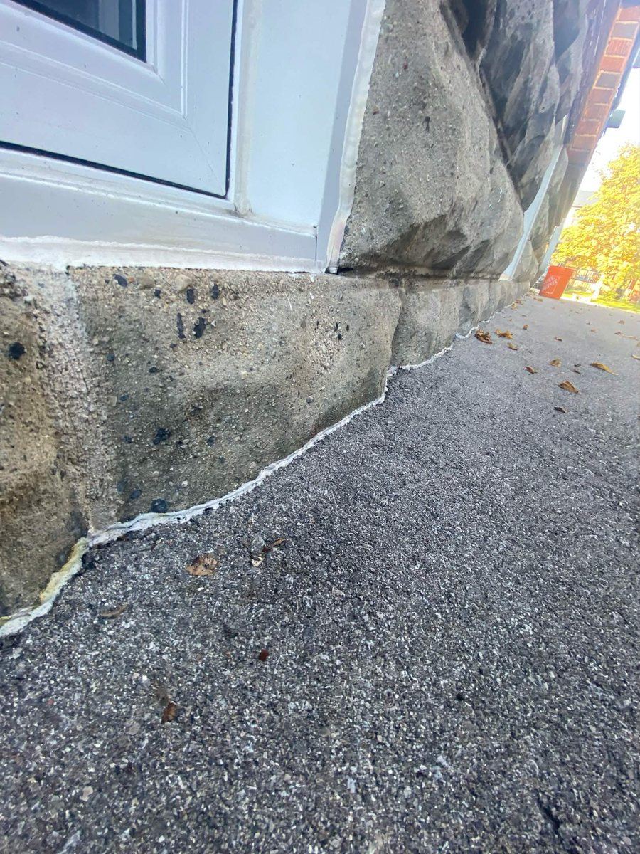 Before: Stone window surround — perimeter joint reset
